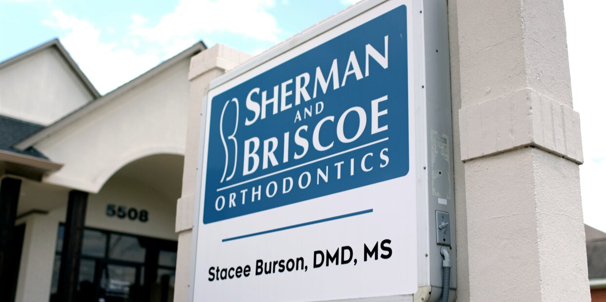 Sherman & Briscoe Orthodontics sign outside the Texarkana office at 5508 Cowhorn Creek Road.